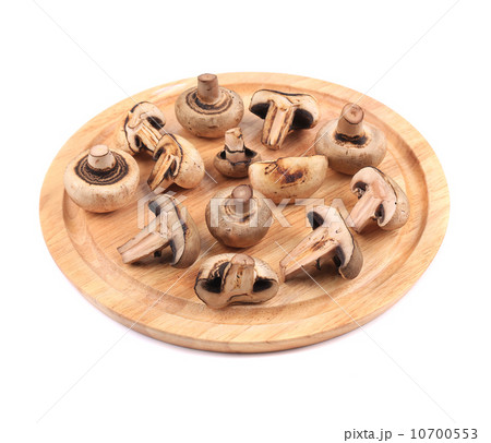 Mushrooms on wooden platter. 10700553
