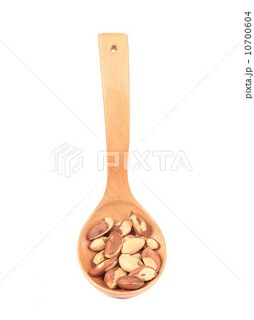 Wooden spoon with brazil nuts. Wooden spoon with brazil nuts. 10700604