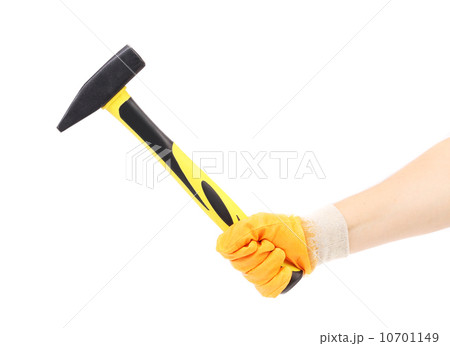 Hand in glove holding hammer. 10701149