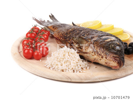 Baked fish on wooden board 10701479