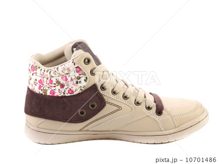Fashion sneaker with flower closeup. 10701486