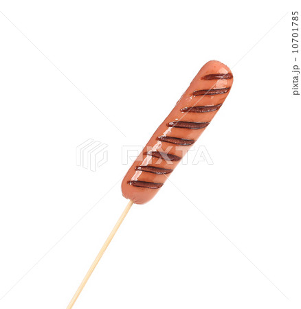 Grilled sausage on a skewer. 10701785