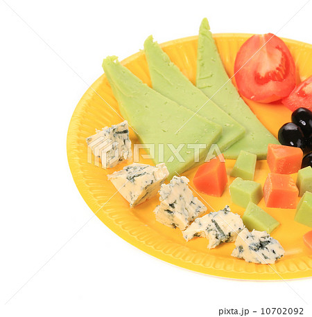 close up of Various cheese on yellow platter close up of Various cheese on yellow platter 10702092