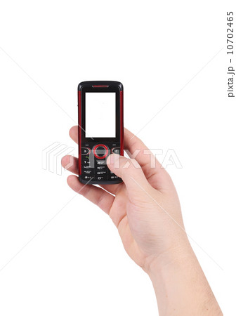 Mobile push-button telephone in hand. 10702465