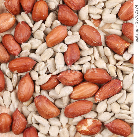 sunflower seeds and peanuts background sunflower seeds and peanuts background 10702574