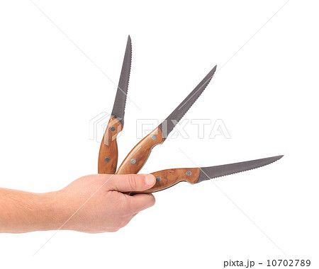Hand holds kitchen knifes. 10702789