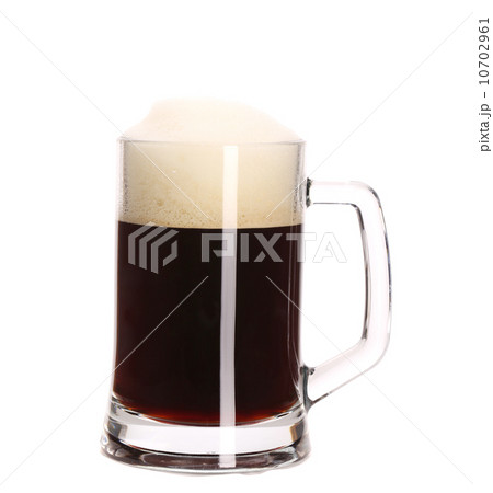 Tall big mug of brown beer with foam. Tall big mug of brown beer with foam. 10702961