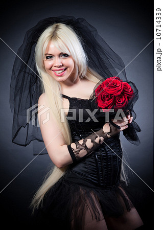black widow in grief with flowers with a veil black widow in grief with flowers with a veil 10714339