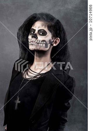 Young woman in day of the dead mask skull. Halloween face art Young woman in day of the dead mask skull. Halloween face art 10714966