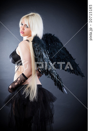 Blond female angel with black wings on a black background 10715165