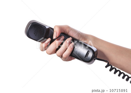 Hand holding an old black telephone tube Hand holding an old black telephone tube 10715891