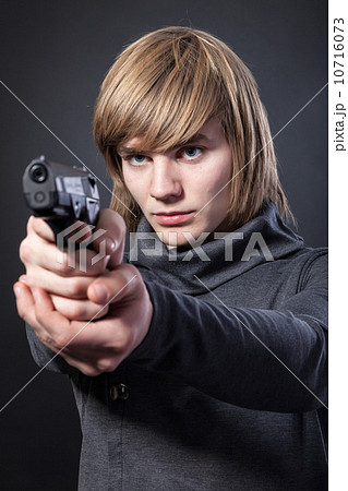 Aiming. Serious man with a gun Aiming. Serious man with a gun 10716073