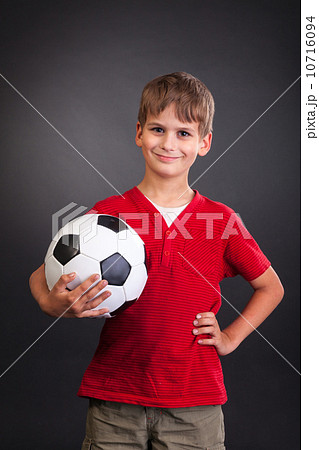 Cute boy is holding a football ball. Soccer ball Cute boy is holding a football ball. Soccer ball 10716094