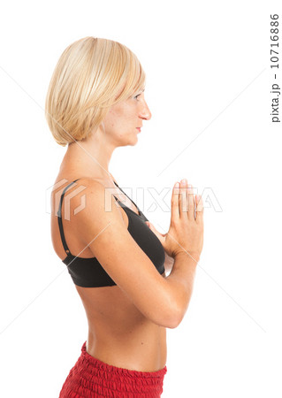 Practicing Yoga. Young woman isolated on white background Practicing Yoga. Young woman isolated on white background 10716886