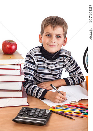 Cute schoolboy is writting Cute schoolboy is writting 10716887