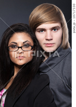 Portrait of happy young couple hugging 10717330