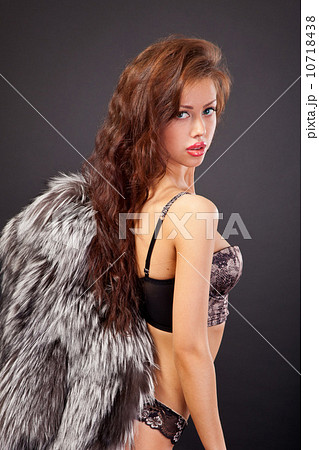 Attractive woman in fur coat and bra Attractive woman in fur coat and bra 10718438
