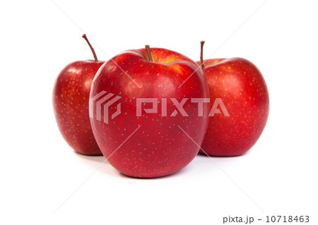 Three shiny red apples isolated on white 10718463