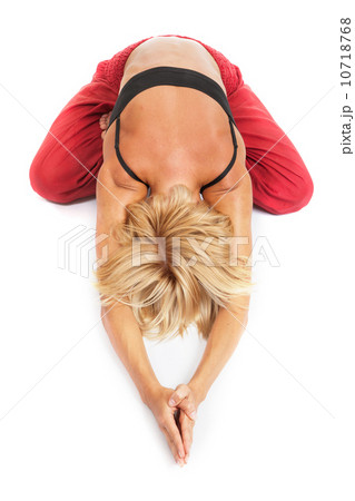 Practicing Yoga. Young woman isolated on white background Practicing Yoga. Young woman isolated on white background 10718768