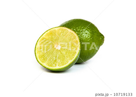 One whole lime and one half lime on white 10719133