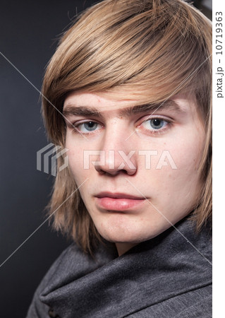 Healthy muscular young man on grey background Healthy muscular young man on grey background 10719363