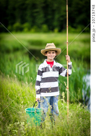 Young boy fishing in a river 10719748