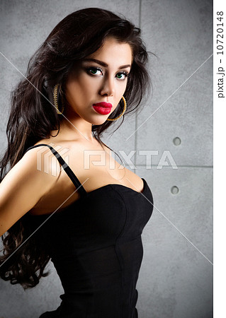 Portrait Of Sexy Woman On a dark metallic Background Portrait Of Sexy Woman On a dark metallic Background 10720148
