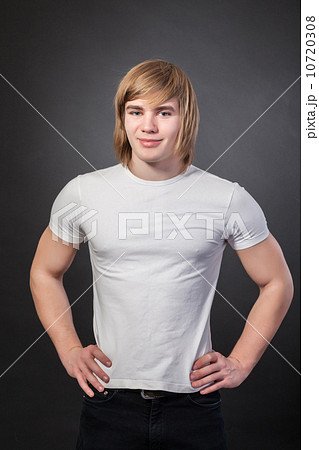 Healthy muscular young man on grey background Healthy muscular young man on grey background 10720308