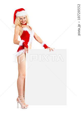Young sexy Santa woman is holding a poster Young sexy Santa woman is holding a poster 10720552