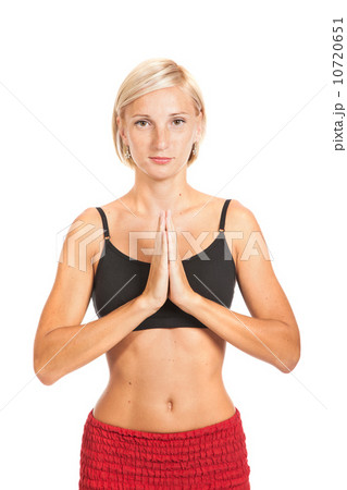 Practicing Yoga. Young woman isolated on white background Practicing Yoga. Young woman isolated on white background 10720651