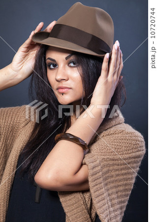 Beautiful woman with a hat on black Beautiful woman with a hat on black 10720744