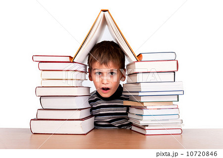 Schoolboy and a heap of books Schoolboy and a heap of books 10720846