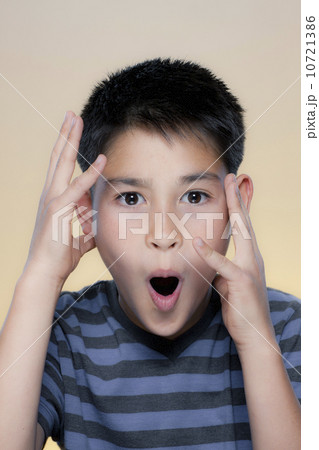 Portrait of boy making facial expression Portrait of boy making facial expression 10721386