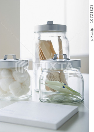 Cotton swabs and tongue depressors in jars Cotton swabs and tongue depressors in jars 10721825