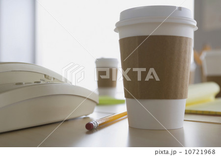 Plastic coffee cup on desk 10721968
