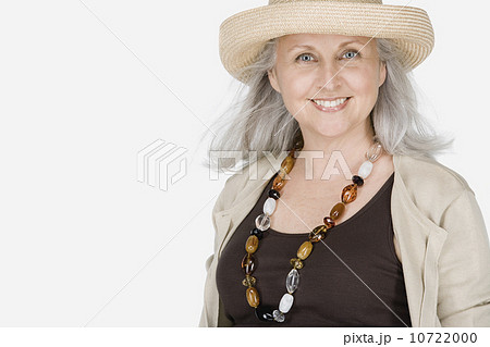 Studio portrait of mature woman wearing hat Studio portrait of mature woman wearing hat 10722000