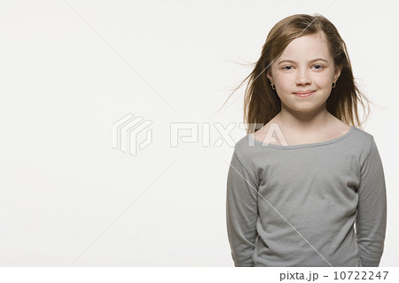 Studio shot of smiling girl (8-9), studio shot 10722247