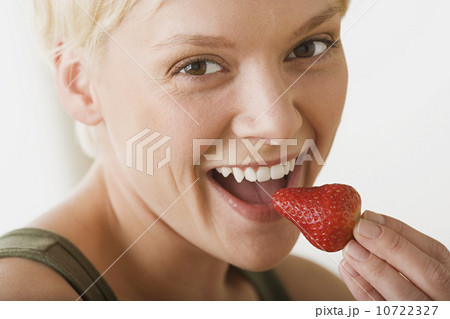 Woman eating strawberry 10722327