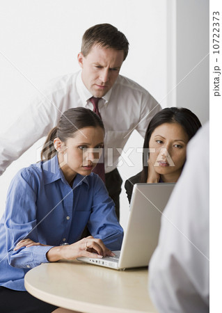 Three people working in office 10722373