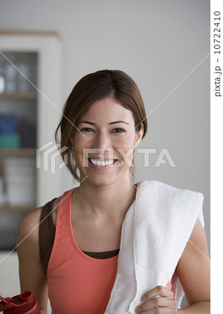 Portrait of smiling woman in gym 10722410