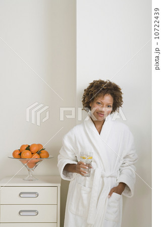 Attractive woman drinking fresh orange juice Attractive woman drinking fresh orange juice 10722439