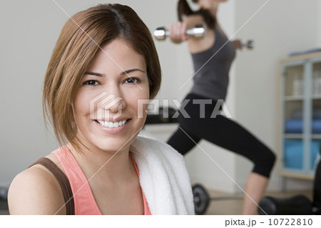 Two women exercising in gym 10722810