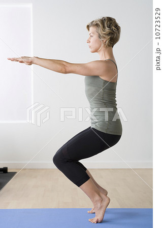 Woman exercising in gym 10723529