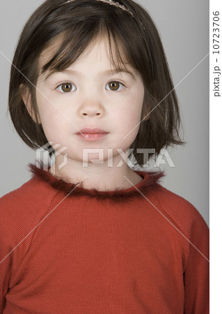 Studio portrait of mixed-race girl (10-11) 10723706
