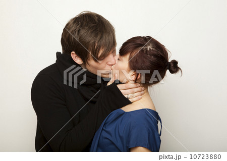 Studio Shot of young couple kissing  10723880