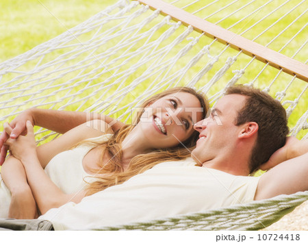 Couple relaxing in hammock Couple relaxing in hammock 10724418