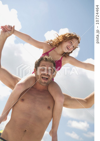 Father carrying daughter on shoulders Father carrying daughter on shoulders 10724464