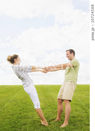 Couple playing on lawn 10724509
