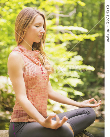 Woman practicing joga in forest Woman practicing joga in forest 10724535