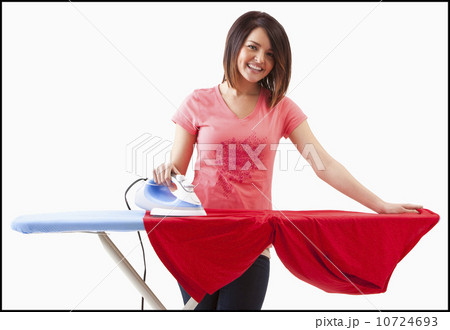 Young woman ironing 10724693